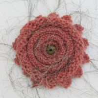 Wool yarn, acrylic wolf's eye, skunk hair, 20"H x 10"W x 2"D, 2003