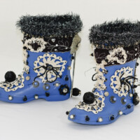 Used gumboots, beads (metal & plastic), lace w/sequins, fabric trim, polyester batting, hooks & eyes, sequin balls, found doilies, metal rings, found pearls, beaded bows, antique shoe hooks, thread, yarn, wire. Each boot is 8.5"H x 4"W x 8.5"D, 2006 (non-wearable)
