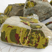 Stones, beads, thread, double-sided tape. Dimensions variable, 2008-11