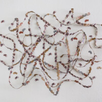 Metal strip of electronic connectors (used in circuit boards), Tootsie Roll wrappers, recycled paper bags, marker,
44"H x 60"W x 9"D, 2013