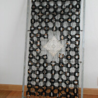 Found metal bed spring, slide mounts, acrylic, cotton crochet thread, found doily, cigarette butts, 51.25"H x 29"W, 2005