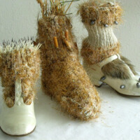 Wool & acrylic yarns, shoes, cigarette butts, weights, porcupine quills, religious medals, faux fur, waxed slide mount with cotton twine, thread, wire, dried jellyfish, straw. Dimensions variable, 2003